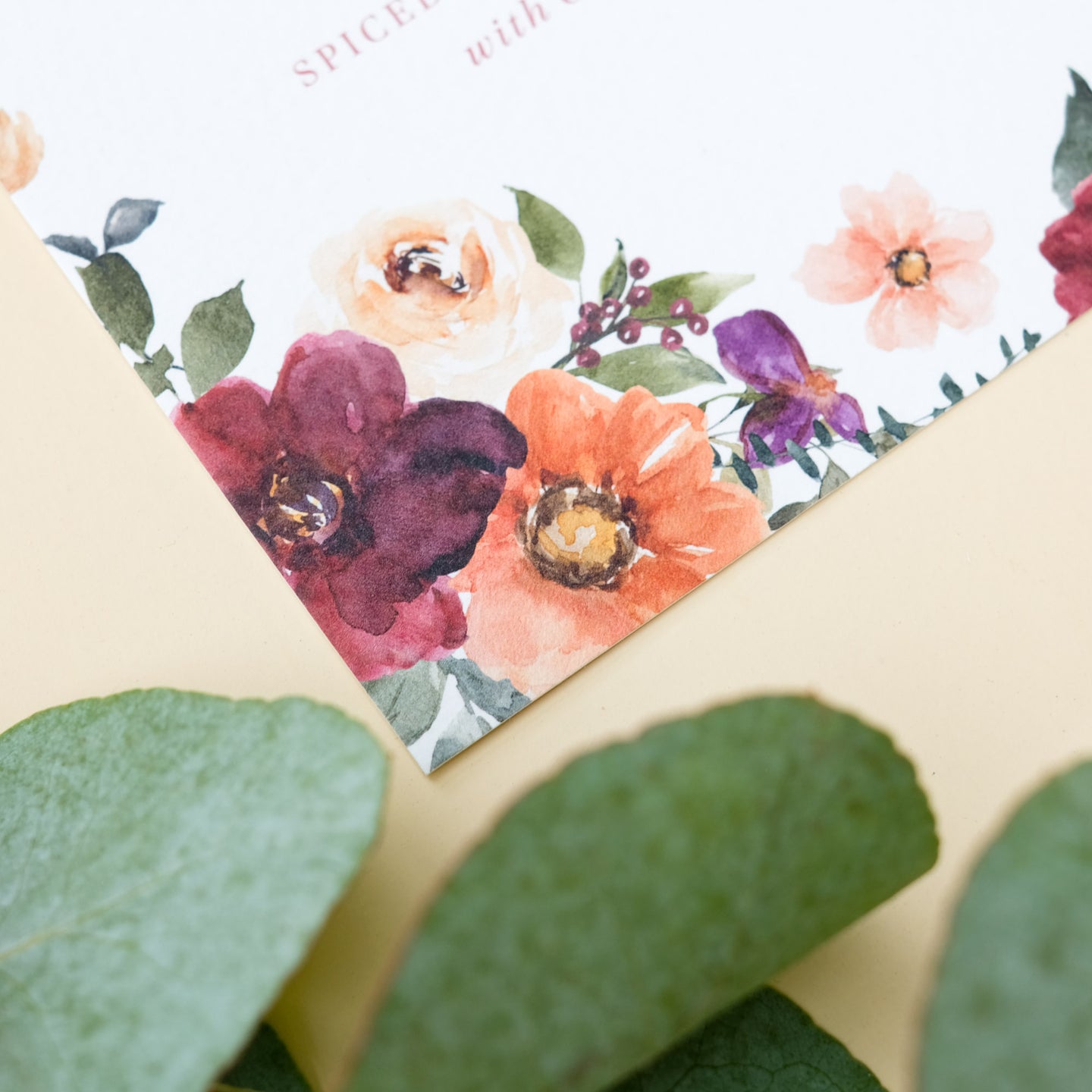 floral wedding menu in burgundy, burnt orange and earthy neutrals with guest name